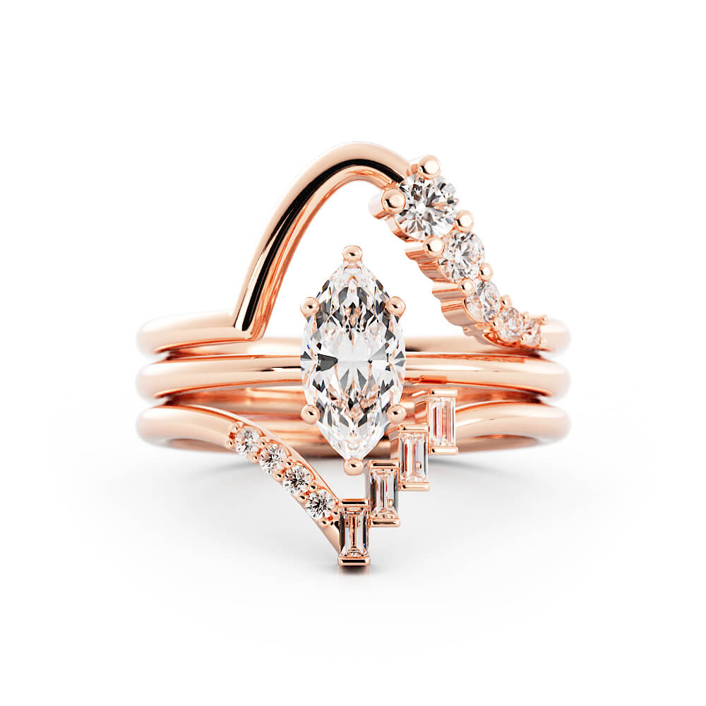14K rose gold custom engagement ring with a lab grown diamond marquise and lab grown diamond baguettes. Tapered matching wedding bands.