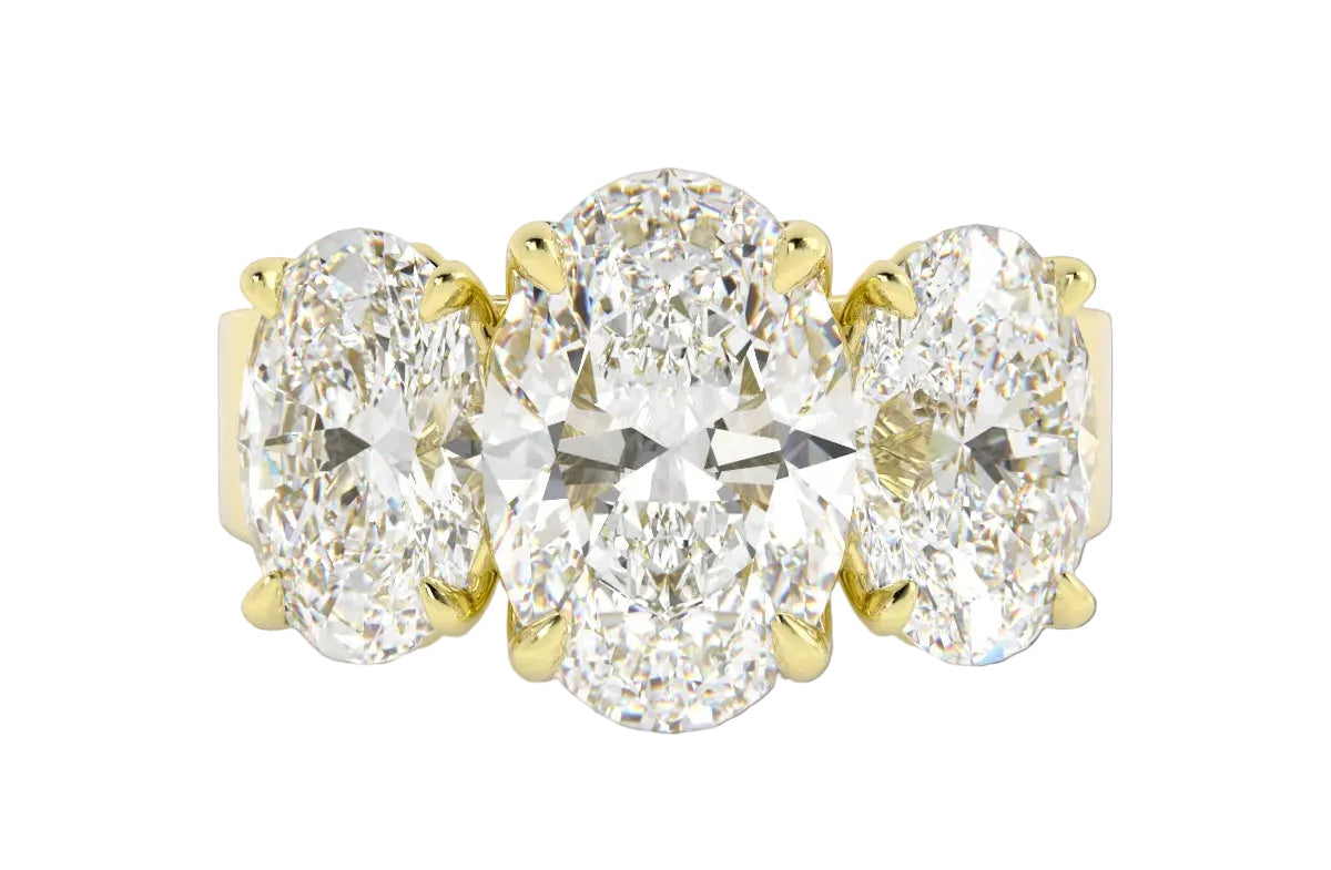 14k yellow gold three stone custom oval engagement ring with a thick chunky band and claw prongs