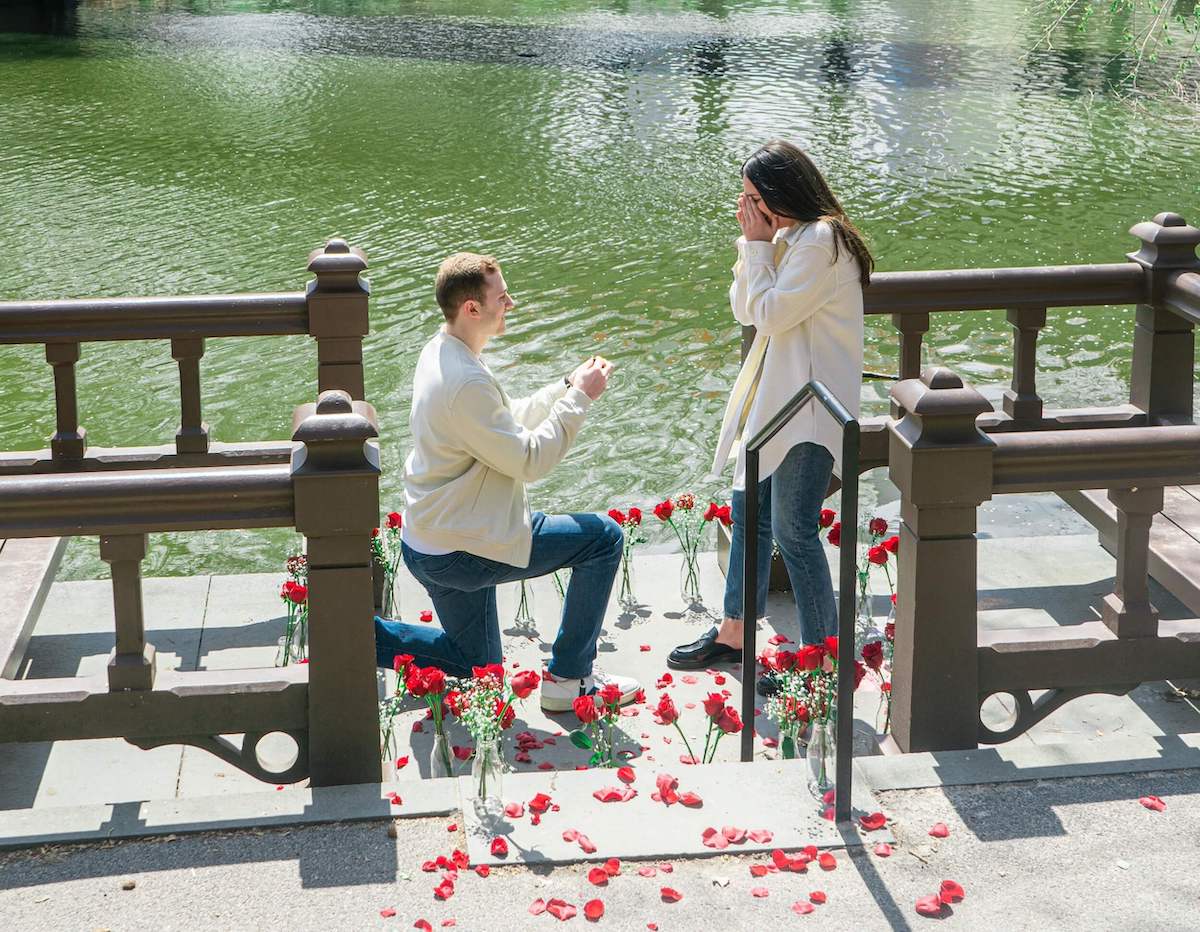 Man proposes to his partner with roses and a custom natural diamond engagement ring